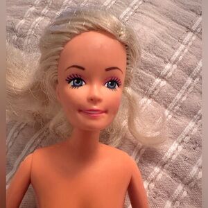 1990 Barbie doll marked Lucky on back.